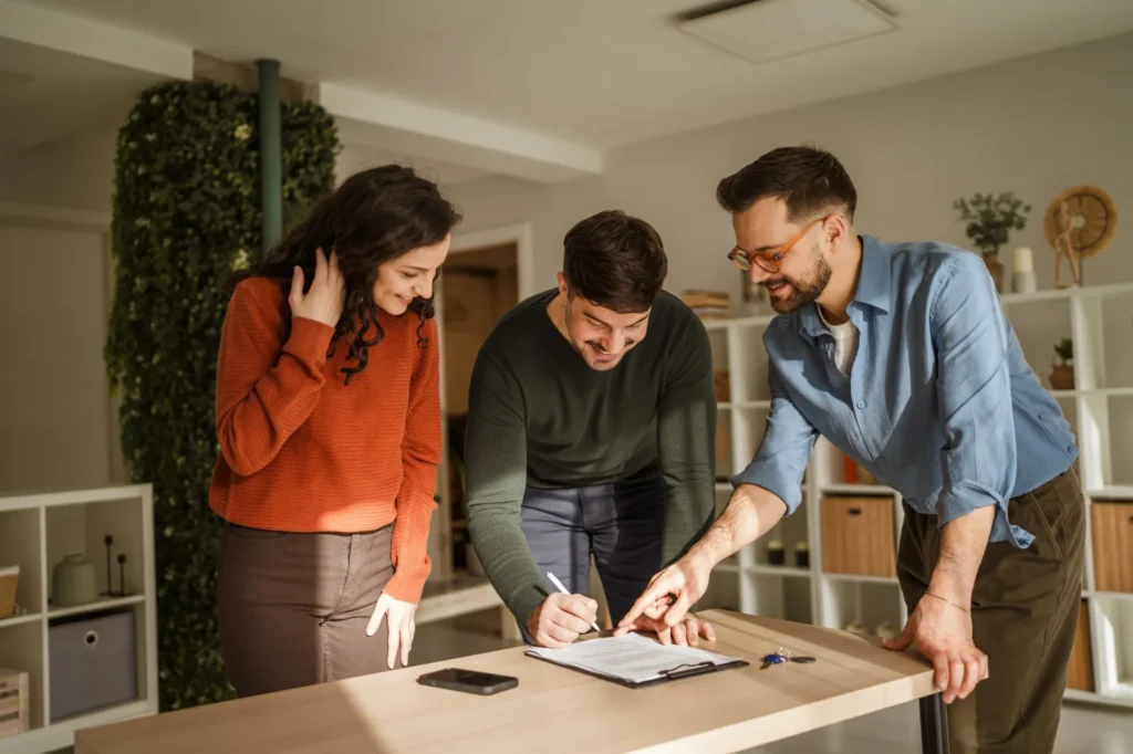 Couple signing legal documents with the help of a lawyer, a family lawyers Toukley consultation